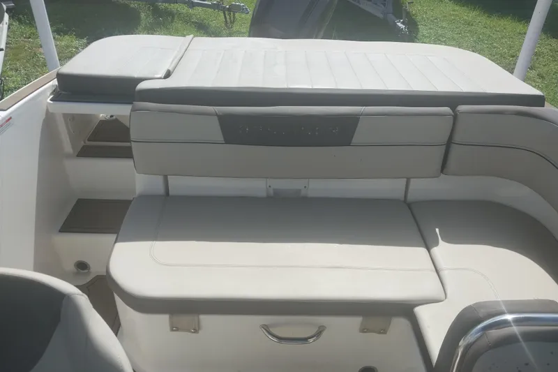 Slide: The Image of 2017 Bayliner VR5 Bowrider OB interior seating with cushioned bench and storage. - 3