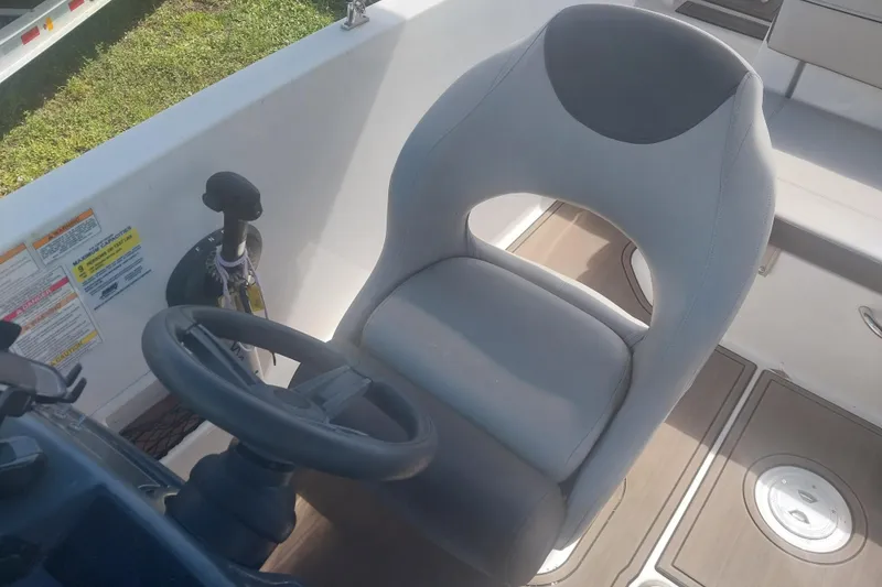 Slide: The Image of 2017 Bayliner VR5 Bowrider OB cockpit with steering wheel and captain's chair. - 6