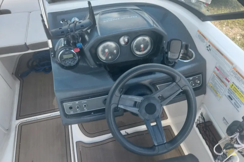 Slide: The Image of 2017 Bayliner VR5 Bowrider OB dashboard with steering wheel and control panel. - 7