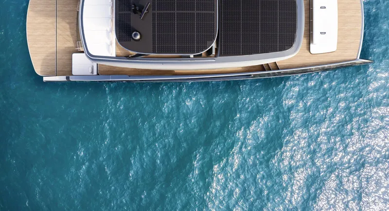 Slide: The Image of Aerial view of 2026 Sunreef 88 Ultima yacht on blue ocean water. - 15