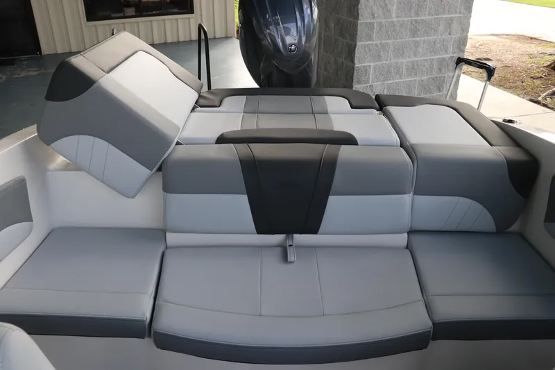 Slide: The Image of 2026 Chaparral 21 SSi OB boat interior with gray and black seating arrangement. - 10
