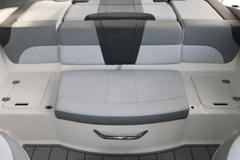 Slide: The Image of 2026 Chaparral 21 SSi OB boat interior seating, featuring sleek gray and white upholstery. - 19