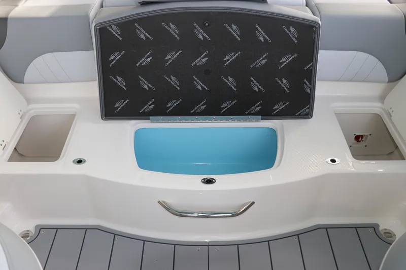 Slide: The Image of 2026 Chaparral 21 SSi OB boat interior with storage compartments and seating area. - 23