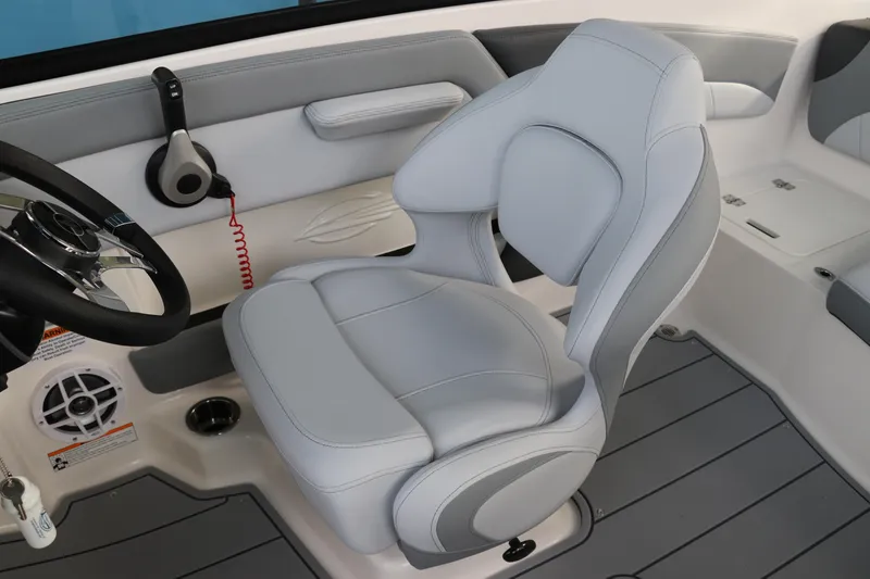 Slide: The Image of 2026 Chaparral 21 SSi OB boat interior with sleek gray captain's seat and steering wheel. - 25