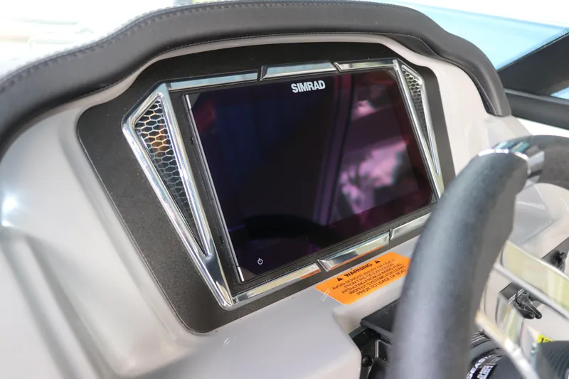Slide: The Image of Dashboard of 2026 Chaparral 21 SSi OB with Simrad display and steering wheel. - 28