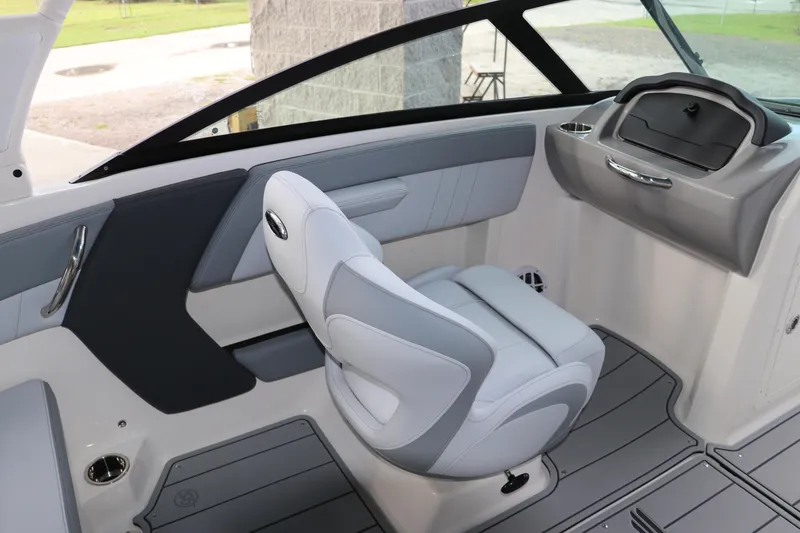 Slide: The Image of 2026 Chaparral 21 SSi OB boat interior with sleek seating and modern dashboard design. - 36