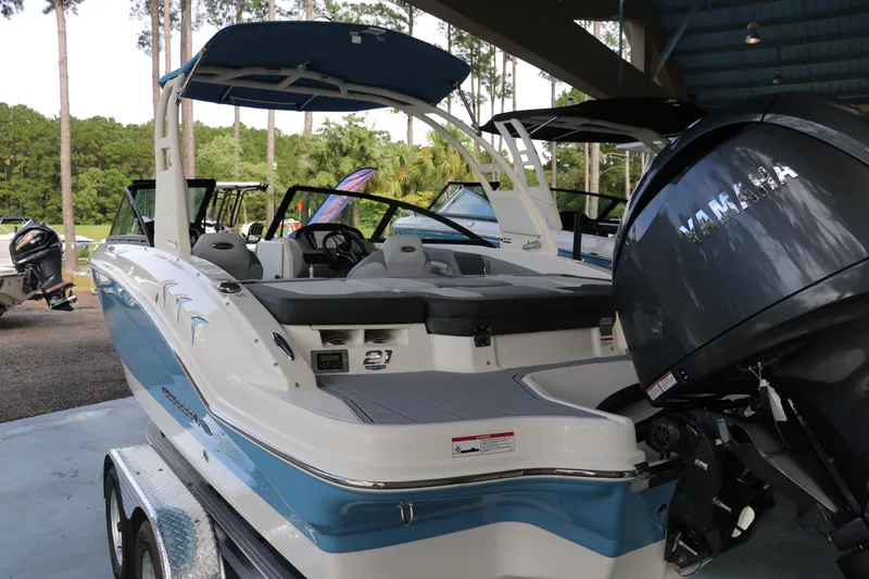 Slide: The Image of 2026 Chaparral 21 SSi OB boat with Yamaha outboard engine, displayed outdoors. - 4