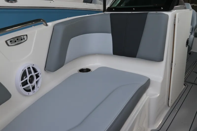 Slide: The Image of 2026 Chaparral 21 SSi OB boat interior with gray seating and speaker. - 49