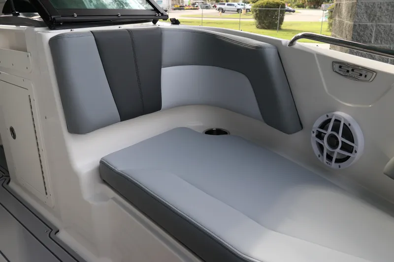 Slide: The Image of Interior seating of 2026 Chaparral 21 SSi OB boat with gray upholstery and speaker. - 50