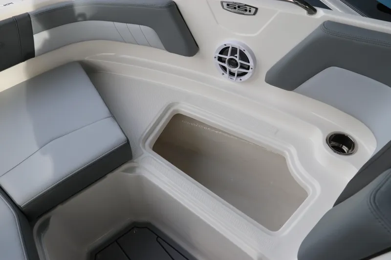 Slide: The Image of 2026 Chaparral 21 SSi OB boat interior with seating, speaker, and storage compartment. - 52