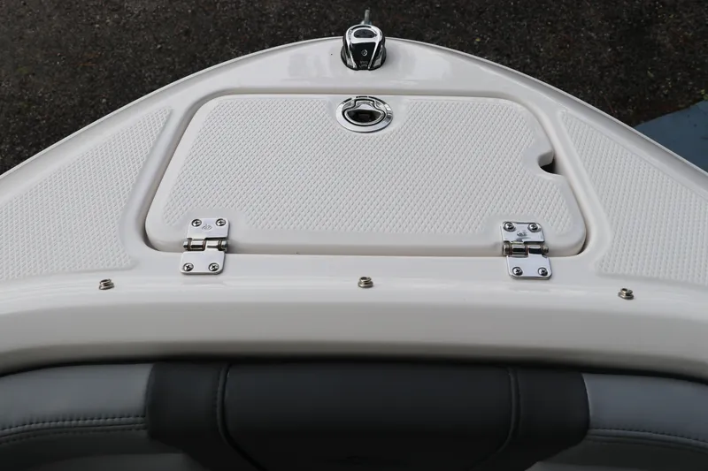 Slide: The Image of 2026 Chaparral 21 SSi OB boat deck with storage compartment and stainless steel hinges. - 54