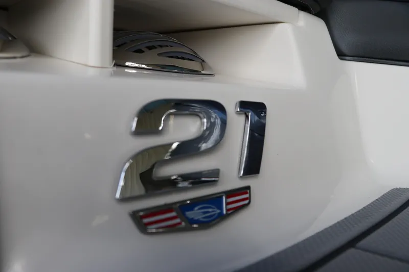 Slide: The Image of 2026 Chaparral 21 SSi OB boat emblem close-up with sleek design details. - 6