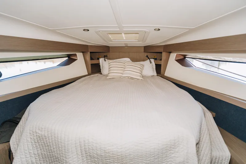 Slide: The Image of Luxurious cabin interior of 2023 Beneteau Gran Turismo 41 yacht with cozy bedding. - 15