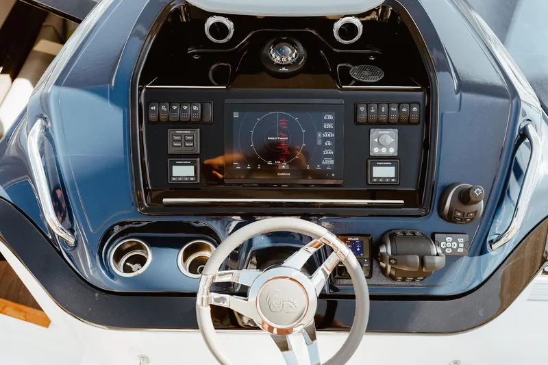 Slide: The Image of 2023 Beneteau Gran Turismo 41 dashboard with steering wheel and navigation controls. - 7