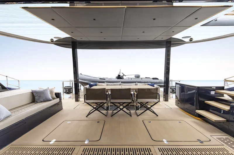 Slide: The Image of Luxurious Sunreef 70 NAOMA yacht deck with seating, 2022 model, featuring modern design and ocean view. - 15
