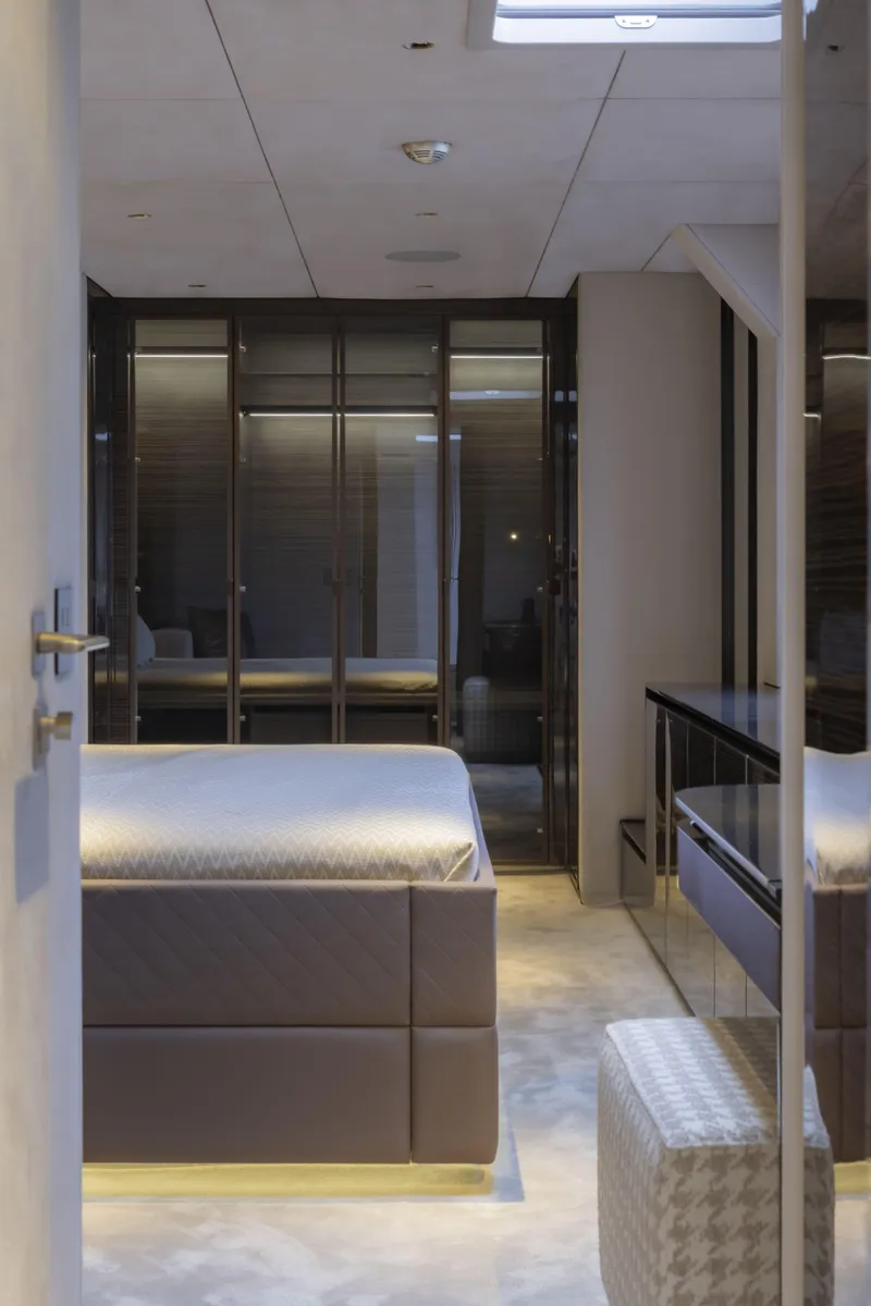 Slide: The Image of Luxurious bedroom interior of 2022 Sunreef 70 NAOMA yacht, featuring modern design and elegant furnishings. - 2