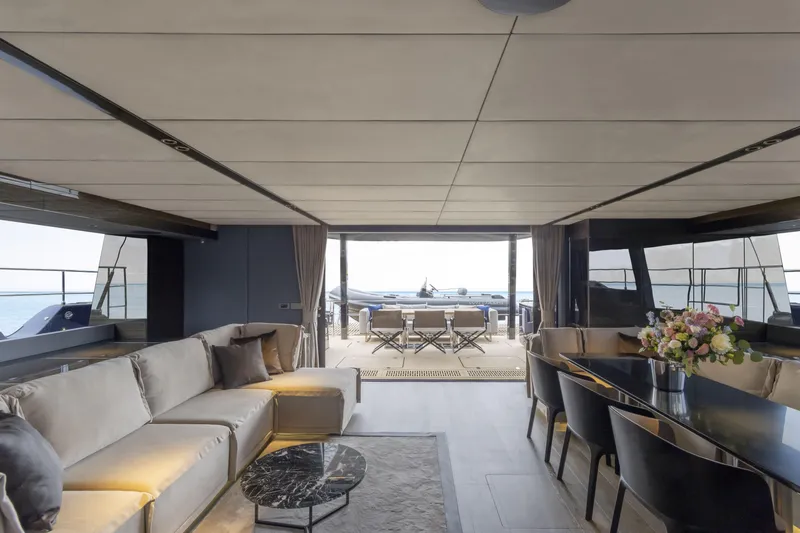 Slide: The Image of Luxurious interior of 2022 Sunreef 70 NAOMA yacht with elegant seating and dining area. - 4