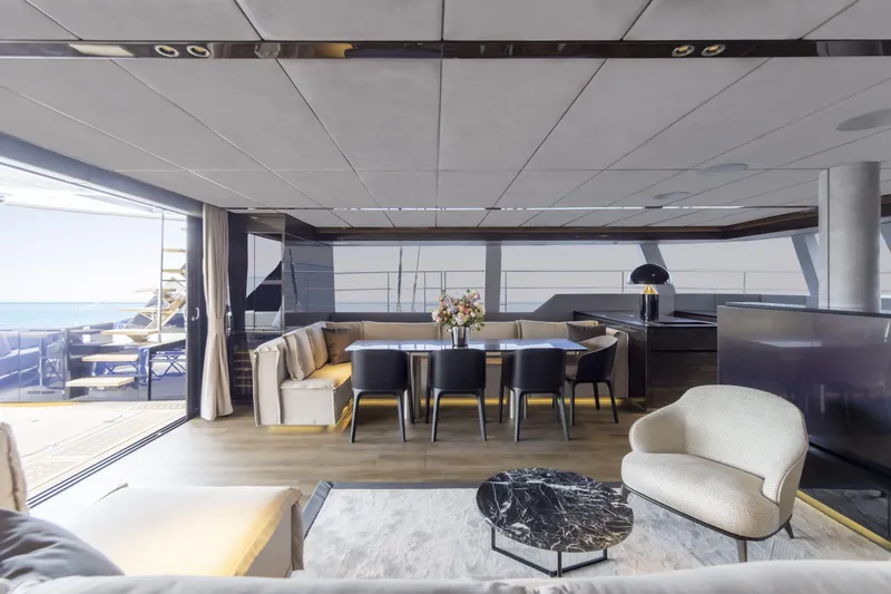 Slide: The Image of Luxurious interior of 2022 Sunreef 70 NAOMA yacht with elegant dining area and ocean view. - 5