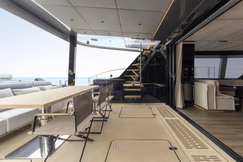 Slide: The Image of Luxurious Sunreef 70 NAOMA yacht deck with elegant seating and ocean view, 2022 model. - 6