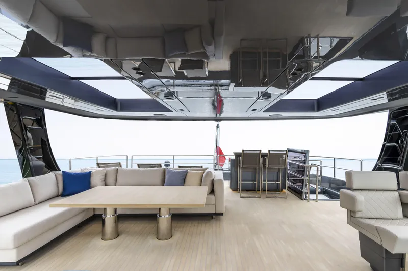Slide: The Image of Luxurious interior of 2022 Sunreef 70 NAOMA yacht with elegant seating and ocean view. - 7