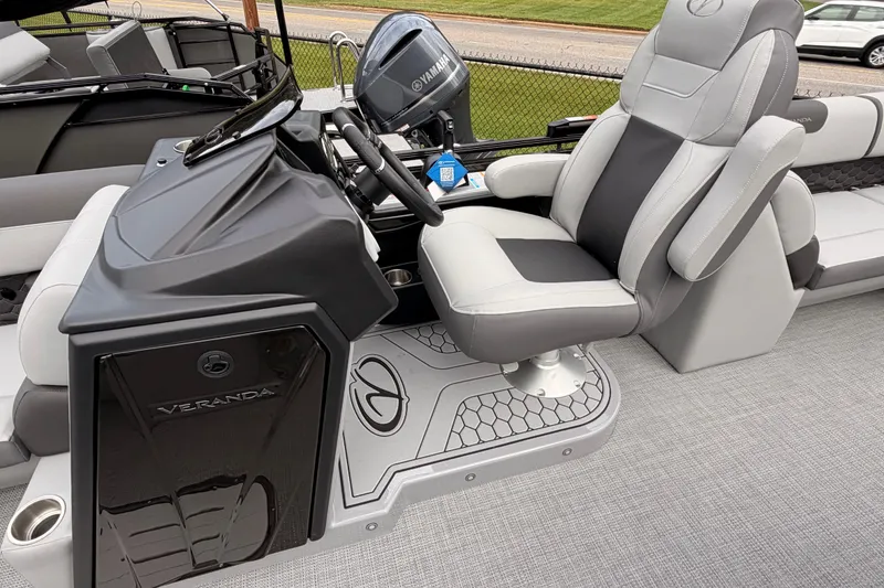 Slide: The Image of 2026 Veranda VR 235 RC boat interior with steering console and luxurious seating. - 13