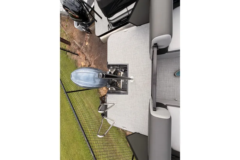Slide: The Image of 2026 Veranda VR 235 RC boat with outboard motor and seating area. - 19