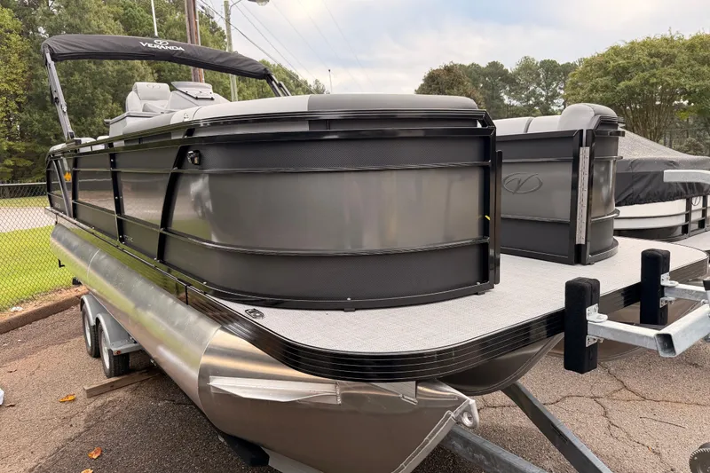 Slide: The Image of 2026 Veranda VR 235 RC pontoon boat on trailer, sleek design, black and silver finish. - 3