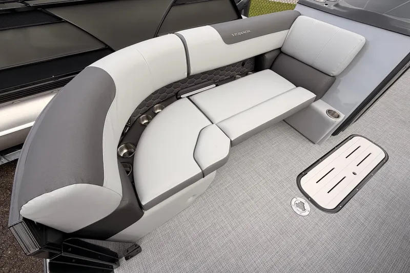 Slide: The Image of Luxurious seating on 2026 Veranda VR 235 RC pontoon boat, featuring sleek design and cup holders. - 9