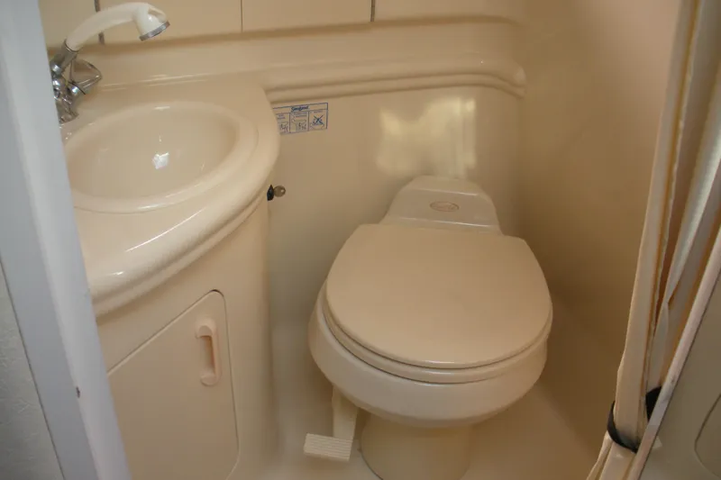 Slide: The Image of 2005 Sea Ray 280 Sundancer bathroom with sink and toilet. - 10