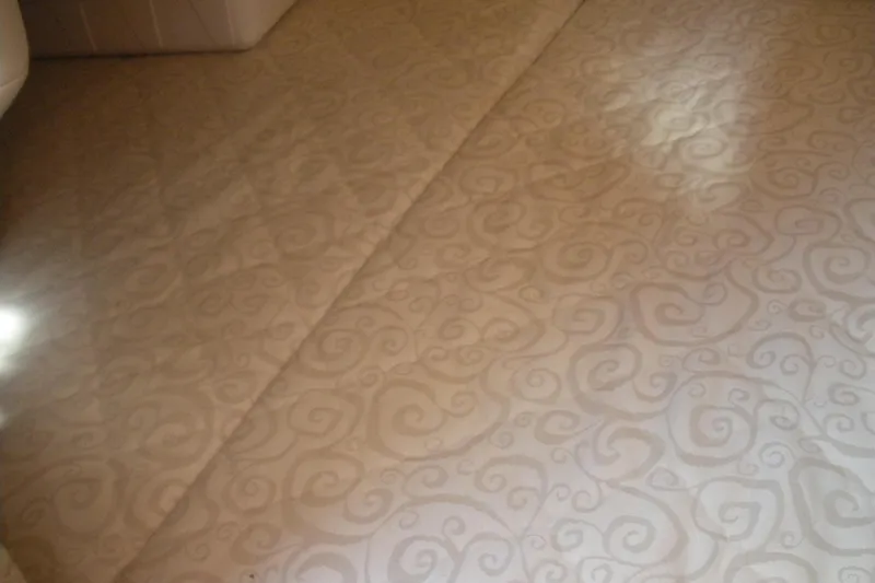 Slide: The Image of Beige patterned upholstery in 2005 Sea Ray 280 Sundancer cabin interior. - 11