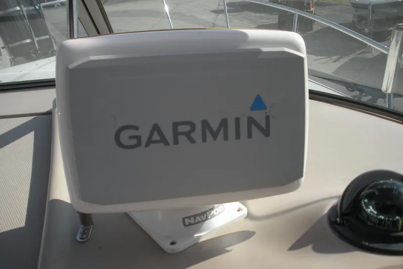 Slide: The Image of Garmin navigation system on 2005 Sea Ray 280 Sundancer boat dashboard. - 13