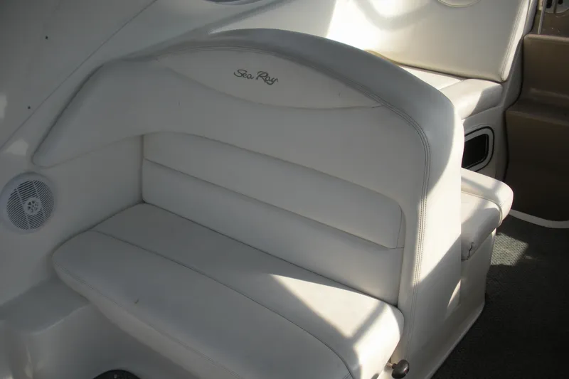 Slide: The Image of White leather seating on 2005 Sea Ray 280 Sundancer boat interior. - 15