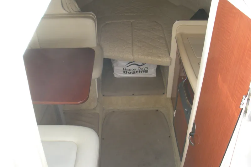 Slide: The Image of Interior of 2005 Sea Ray 280 Sundancer boat with seating and table. - 2