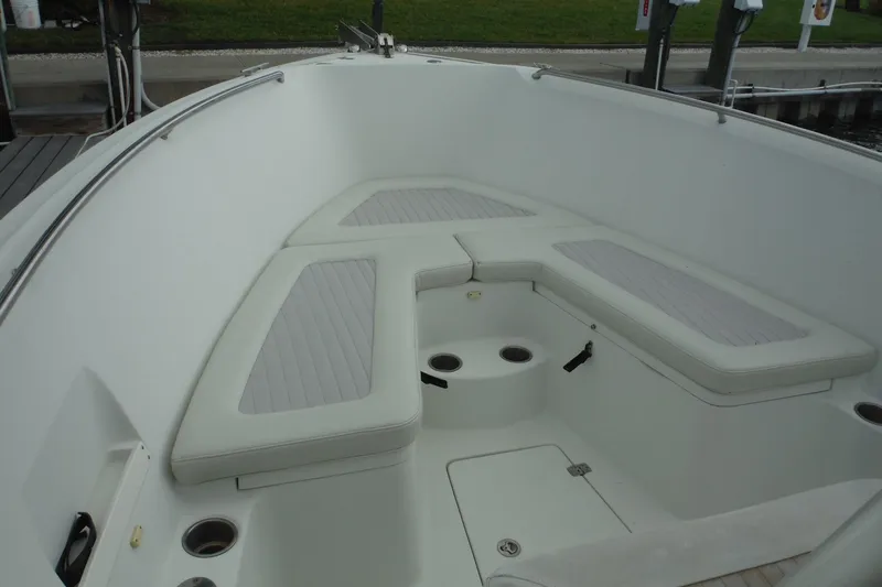 Slide: The Image of 2008 Sailfish 2660 CC boat interior with cushioned seating and cup holders. - 10