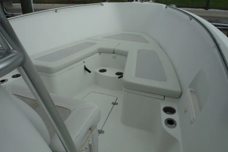 Slide: The Image of 2008 Sailfish 2660 CC boat interior with cushioned seating and cup holders. - 12