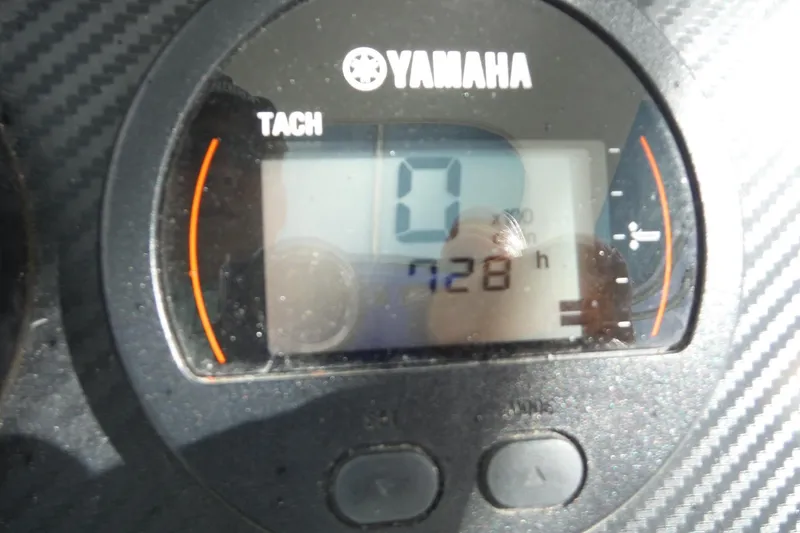 Slide: The Image of Yamaha tachometer displaying 728 hours on a 2008 Sailfish 2660 CC boat. - 18