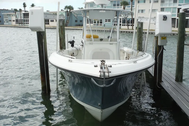 Slide: The Image of 2008 Sailfish 2660 CC boat docked at marina, front view. - 2