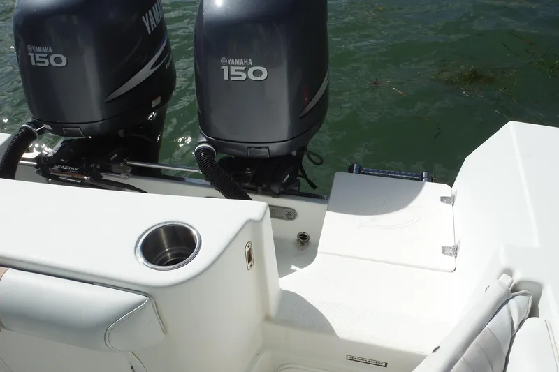 Slide: The Image of 2008 Sailfish 2660 CC boat with twin Yamaha 150 engines on water. - 28