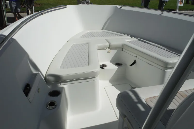 Slide: The Image of 2008 Sailfish 2660 CC boat interior with cushioned seating and cup holders. - 30
