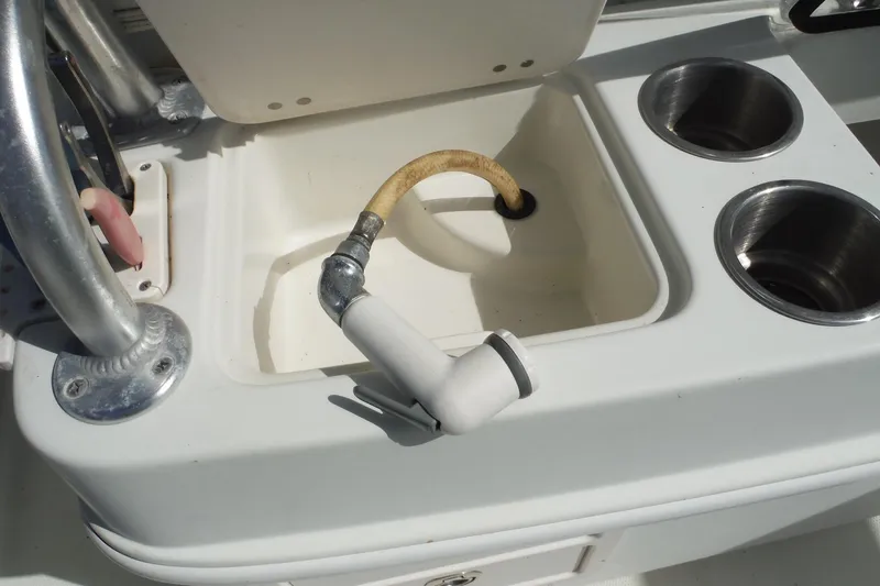 Slide: The Image of 2008 Sailfish 2660 CC boat sink with hose and cup holders. - 39
