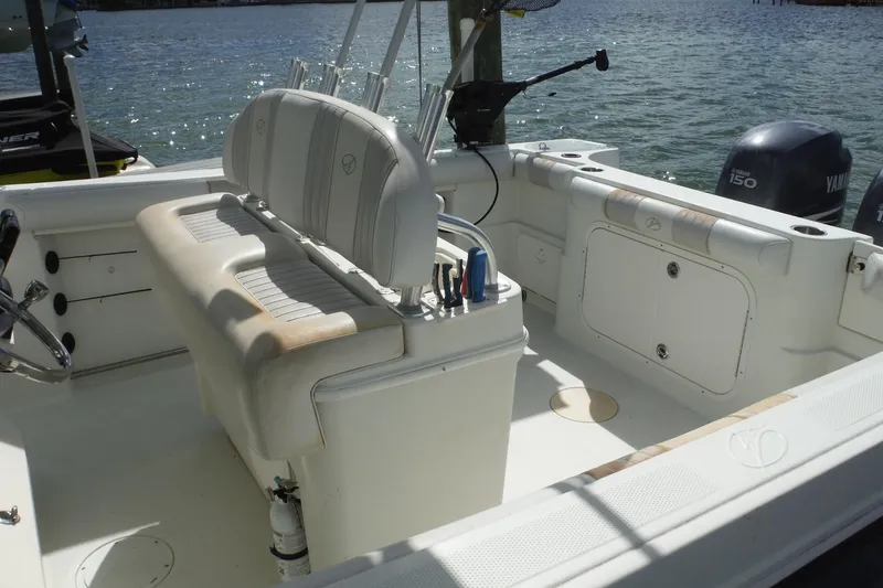 Slide: The Image of 2008 Sailfish 2660 CC boat interior with seating and Yamaha engines. - 43