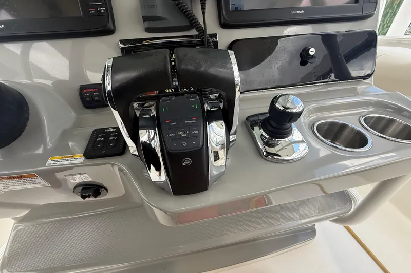 Slide: The Image of Control panel of a 2016 Boston Whaler 330 Outrage boat with throttle and joystick. - 15