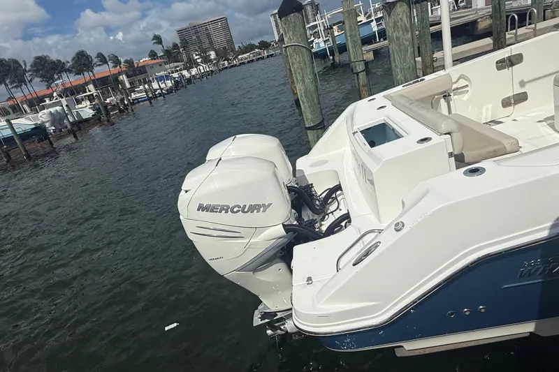 Slide: The Image of 2016 Boston Whaler 330 Outrage with Mercury engine docked at marina. - 5