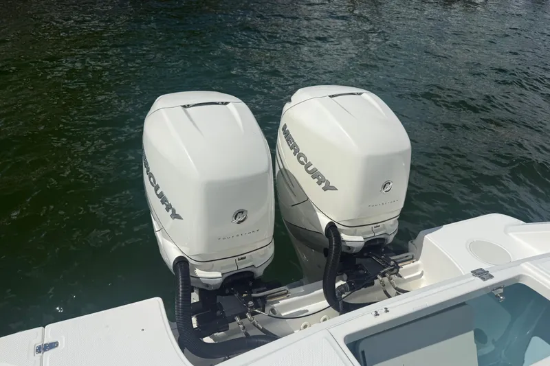 Slide: The Image of Twin Mercury outboard engines on a 2016 Boston Whaler 330 Outrage boat. - 6