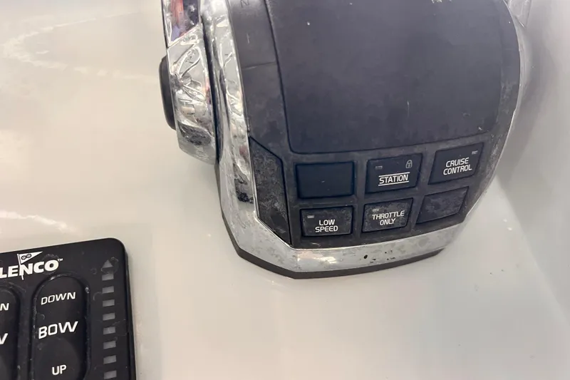 Slide: The Image of Control panel of a 1989 Shamrock 260 Hardtop boat with various function buttons. - 13