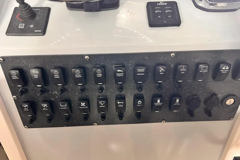 Slide: The Image of Control panel of a 1989 Shamrock 260 Hardtop boat with labeled switches and buttons. - 15