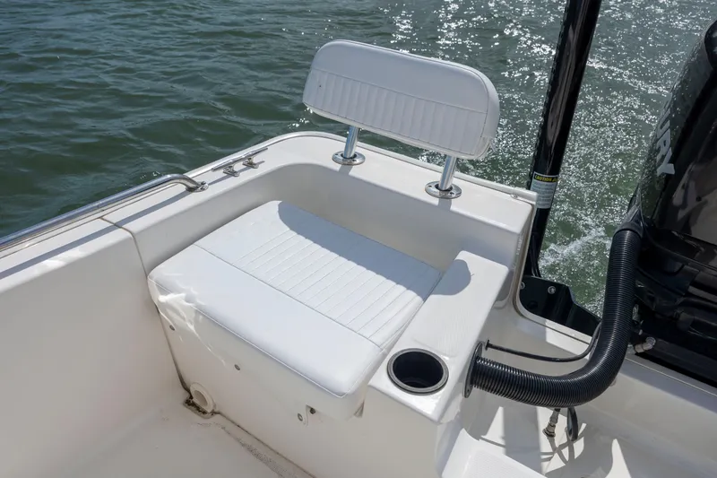 Slide: The Image of 2018 Boston Whaler 210 Montauk boat seat and motor detail on water. - 15