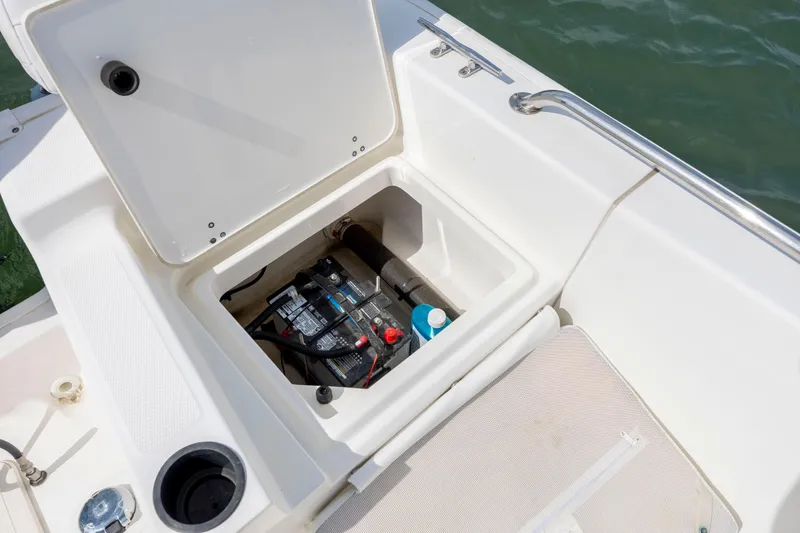 Slide: The Image of 2018 Boston Whaler 210 Montauk boat battery compartment with open hatch. - 21