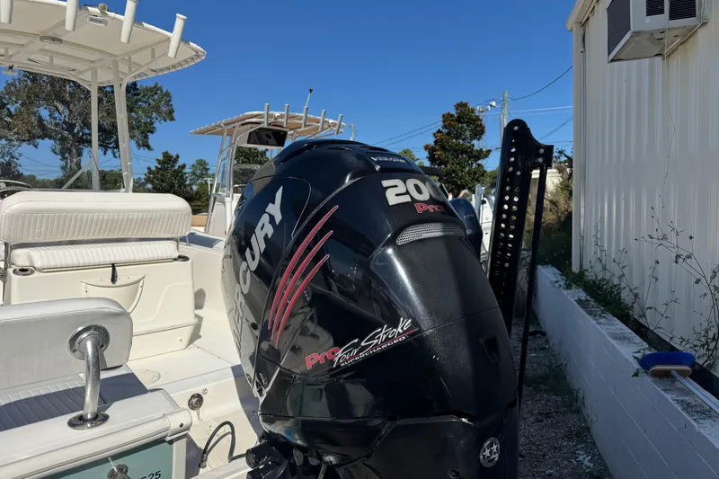 Slide: The Image of 2018 Boston Whaler 210 Montauk with Mercury 200 Pro outboard motor, docked outdoors. - 28