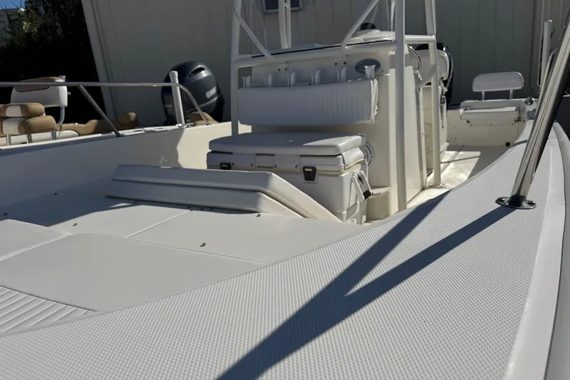 Slide: The Image of 2018 Boston Whaler 210 Montauk boat interior with seating and console. - 30